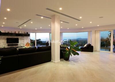 Spacious modern living room with large windows and scenic views