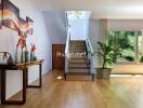 Modern hallway with staircase and large windows