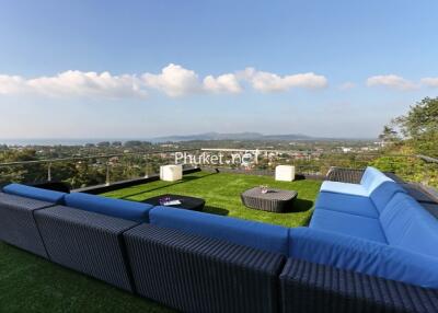 Outdoor seating on rooftop with scenic view