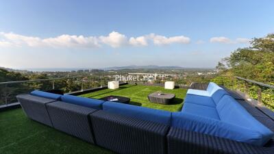 Outdoor seating on rooftop with scenic view