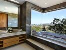 Luxurious bathroom with dual sinks and a scenic view from the bathtub