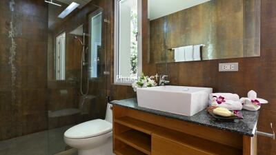 Modern bathroom with glass shower and sink