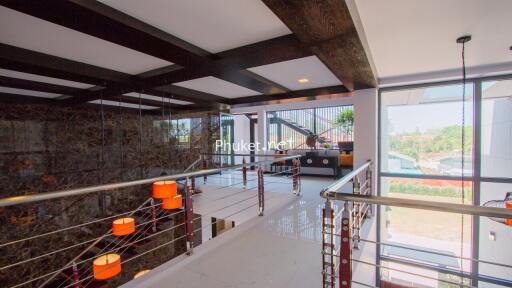 Modern interior hallway with large windows and stylish lighting