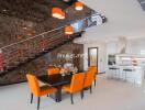 Modern dining area with orange chairs and kitchen in a luxury home