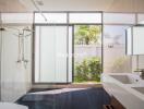 Modern bathroom with large windows and glass shower