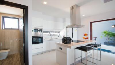 Modern kitchen with island and adjacent outdoor area