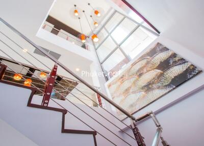 Modern staircase with chandelier