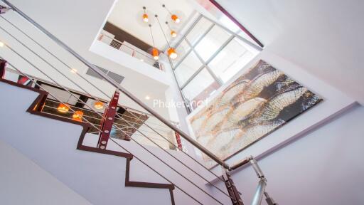 Modern staircase with chandelier