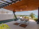 Outdoor balcony with dining area and ocean view