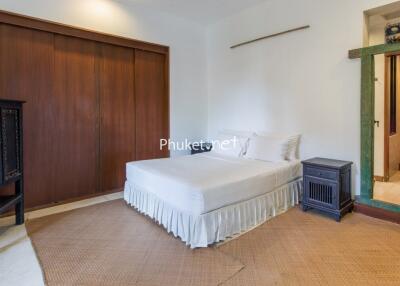 Bedroom with wooden wardrobe and ensuite bathroom