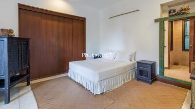 Bedroom with wooden wardrobe and ensuite bathroom