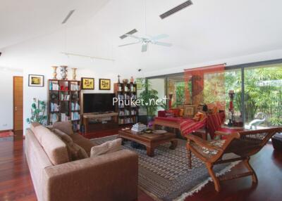 Spacious living room with modern decor and large windows