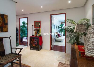 Hallway with adjacent bedrooms and living area