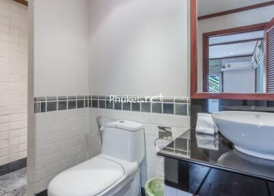 Modern bathroom with sink, toilet, and shower