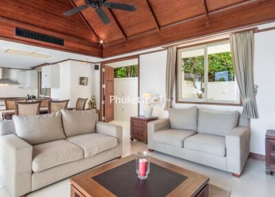 Modern living room with open kitchen and dining area