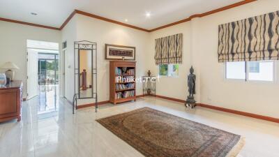 Spacious living room with natural light and decorative elements