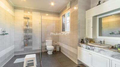 Modern bathroom with shower, toilet, and sink