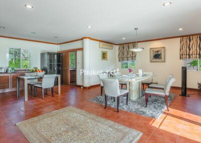 Spacious living and dining area with modern amenities and natural lighting