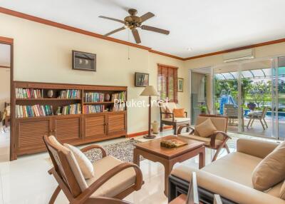 Spacious living room with large windows and garden view