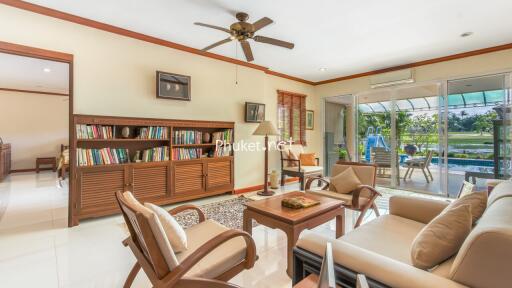 Spacious living room with large windows and garden view