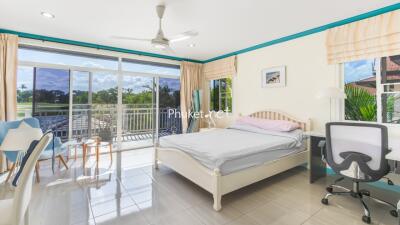 Bright bedroom with a balcony