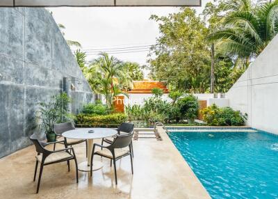 Outdoor area with seating and swimming pool