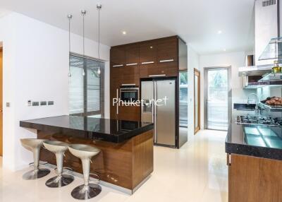 Modern kitchen with island and stainless steel appliances