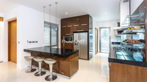 Modern kitchen with island and stainless steel appliances