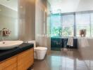 Modern bathroom with wooden vanity and large glass shower