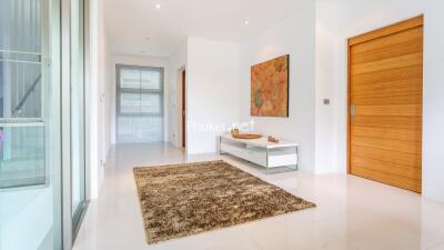 Entrance hallway with a brown rug