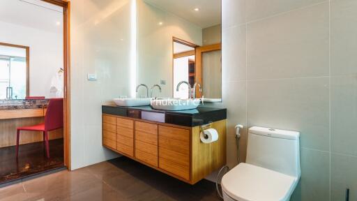 Modern bathroom with dual sinks and toilet