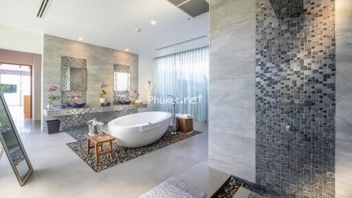 Modern bathroom with freestanding tub and walk-in shower