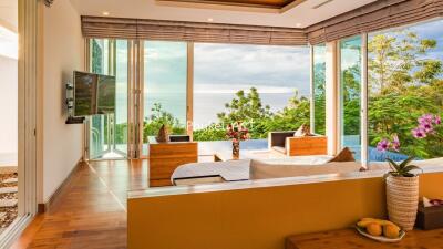 Modern living room with large windows and ocean view