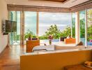 Modern living room with large windows and ocean view