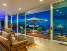 Elegant living room with outdoor terrace at night