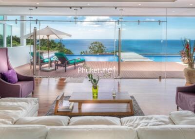 Living area with pool and ocean view