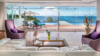 Living area with pool and ocean view