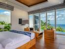 Bedroom with a sea view, contemporary furniture, and large windows