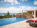 Infinity pool with ocean view and lounging area