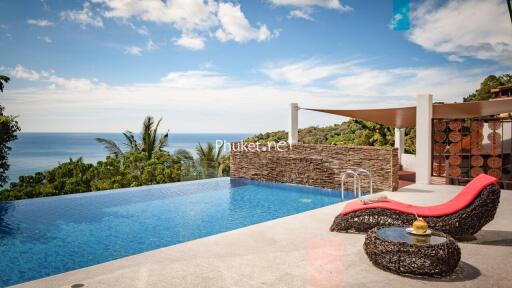 Infinity pool with ocean view and lounging area