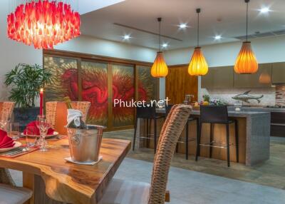 Modern kitchen and dining area with decorative lighting