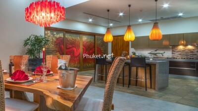 Modern kitchen and dining area with decorative lighting