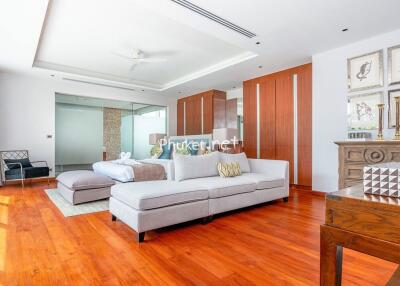 Spacious bedroom with seating area and modern decor