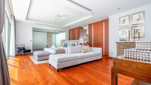 Spacious bedroom with seating area and modern decor