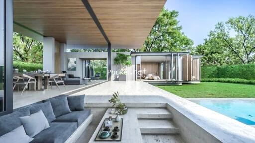 Modern outdoor living space with pool, seating area, and dining area