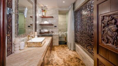 Luxurious bathroom with intricate wooden details