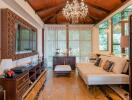 Elegant and spacious living room with chandelier and wooden ceiling