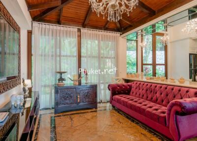 Elegant living room with chandelier and large sofa