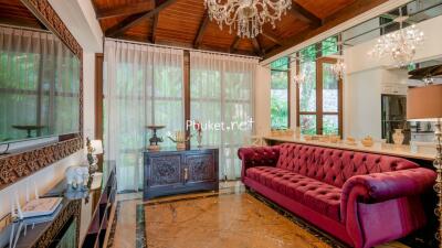 Elegant living room with chandelier and large sofa