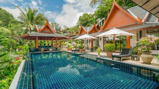 luxury outdoor pool area with traditional architecture